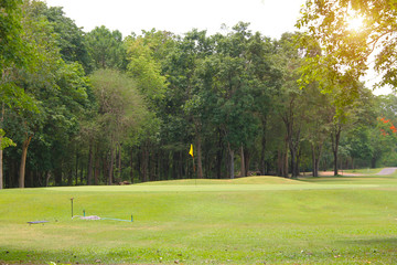 Fototapeta premium The evening golf course has sunlight shining down at golf course in Thailand