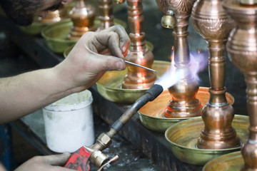 Welding work in a street of the Medina of Tunis, Tunisia