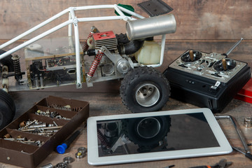 computer tablet with RC radio control car and tools