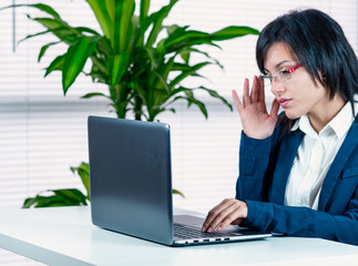 business woman in front of pc notebook. smart working. Office situation. - 329779002