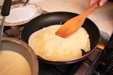 process of cooking pancakes on a hot skillet