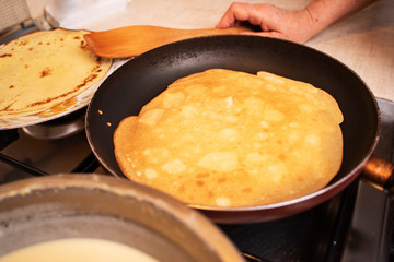 process of cooking pancakes on a hot skillet