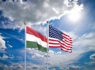 United States of America vs Hungary. Thick colored silky flags of America and Hungary. 3D illustration on sky background. - Illustration