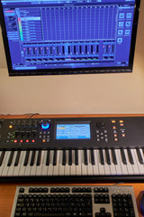 Home studio composed of synthesizer and  computer 