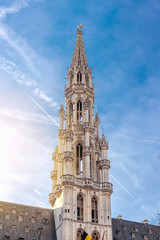 Fototapeta na wymiar Tower of the town hall on Grand Place square in Brussels, Belgium