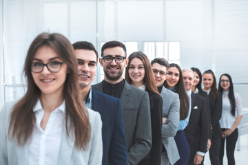 large group of young business people standing in a row.