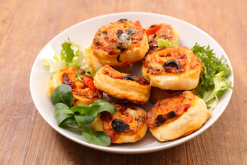 puff pastry roll with olive and tomato sauce-appetizer, finger food, snack