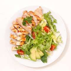 fried chicken fillet with vegetable salad in  plate