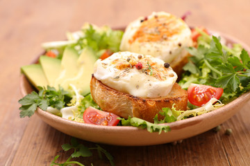 vegetable salad with goat cheese toast and avocado
