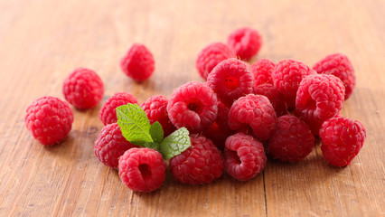 raspberry heap on wood background
