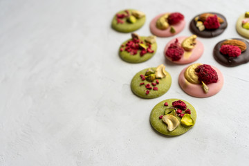 Handmade chocolate medians matcha closeup