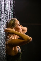 beautiful girl washes in the shower