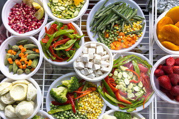 A set of different frozen vegetables.