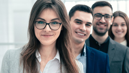 group of young business people showing thumbs up