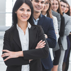 group of confident young people standing in a row