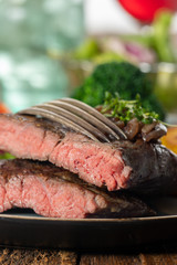 halves of a steak on a plate
