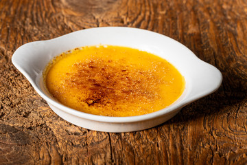 creme brulee on dark wood