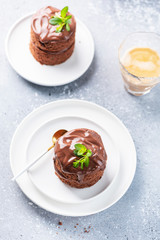 Chocolate mini cake with chocolate ganash and mint