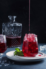 Red cockatil with ice and mint