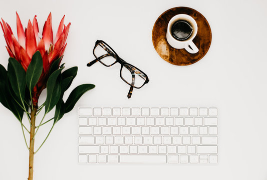 Flay Lay Of A White Keyboard, With Coffee And Accessories For Business Advertisement