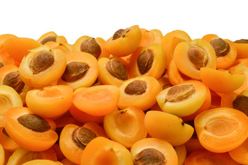 Ripe juicy orange apricots slices fruit background.