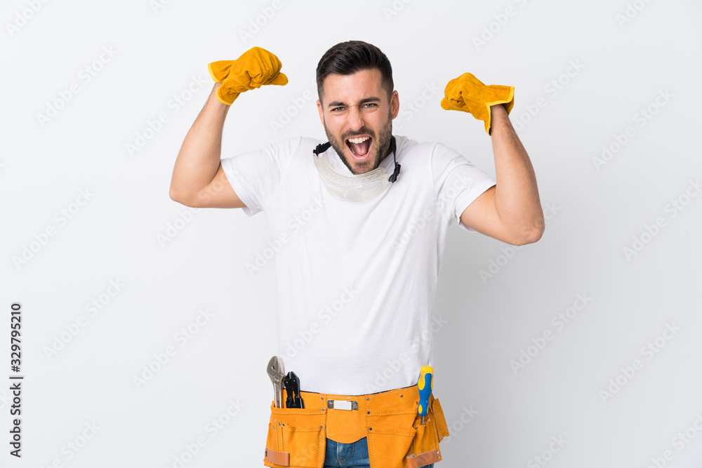 Poster Craftsmen or electrician man over isolated white background celebrating a victory