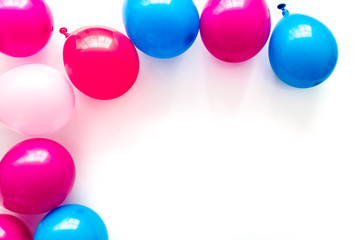 Colorful balloons frame on white background top-down frame copy space