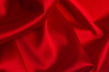 Red silk or satin luxury fabric texture can use as abstract background.