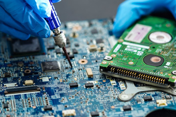 Technician repairing micro circuit main board computer electronic technology : hardware, mobile...