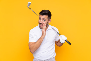 Golfer player man over isolated yellow background whispering something
