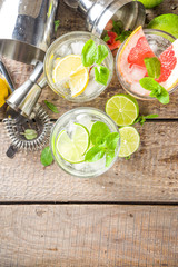 Summer detox beverage  concept. Citrus fruit drinks with ice. Healthy diet cocktail with making bar tools.  Vitamin fortified water