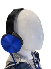 Headphones on head of puppet isolated on black background.This had clipping path.