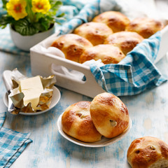 Traditional easter hot cross buns on a wooden rustic table close up. 