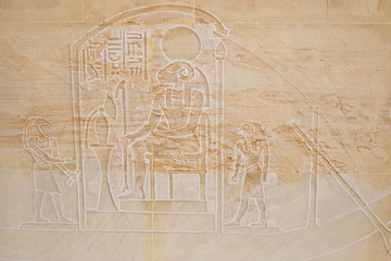 Ancient Egyptian background. Part of the wall with an ancient Egyptian mural and hieroglyphs, the...