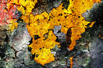Surface texture with gray and yellow color on a cracked surface structure on which the paint peels off. For abstract backgrounds.