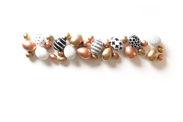 Top view of multi-colored large and small eggs. Nordic style