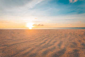 Obraz na płótnie Canvas Sand and beach with sunset, peaceful sandy beach, sun beams. Calmness and relaxation tropical nature pattern