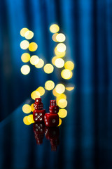 Red dices with reflection with a nice blurry bokeh effect. photography art, light bokeh,...