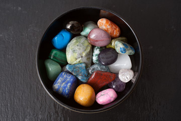 A bowl of different gemstones