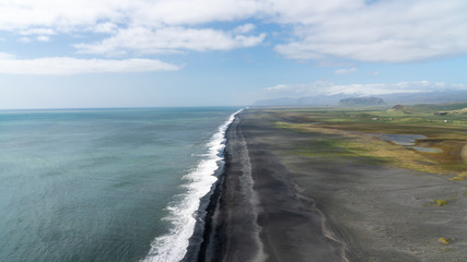 Endless volcanic black sand beach in Vik, Iceland