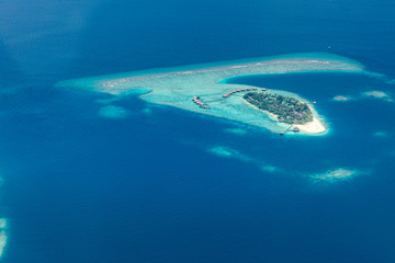 Naklejka premium Aerial view of Maldives atolls is the world top beauty. Maldives tourism, luxury travel destination landscape, seascape