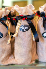 Bottle of wine in their burlap surrounded by a cord