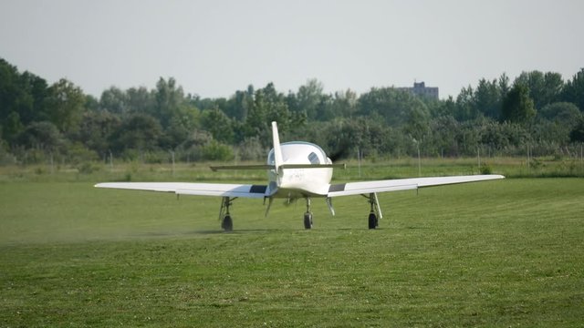 Ultralight small private aircraft airplane moving on the airfield. Aviation festival holiday at the aerodrome airport 