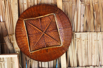 Antique bamboo basket hanging in a Thai rural house