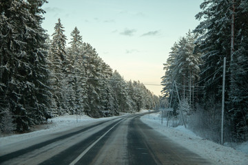 Winter country road in snowy winter day