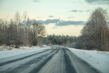 Fototapeta na wymiar Winter country road in snowy winter day