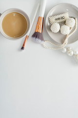 Wedding background, decorated with decorations for the bride's dress, white feather, cotton flower, pearl hairpins, around the text space, all in pastel colors. Concept preparation for the wedding