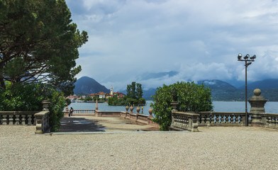 View of the island of Dei Pescatori on the Isola Bella embankment . lago maggiore. Soft focus, blurry background.