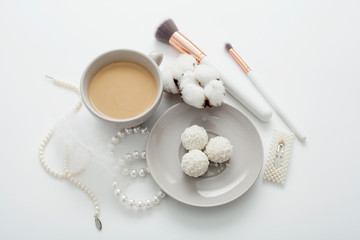 Wedding background, decorated with decorations for the bride's dress, white feather, cotton flower, pearl hairpins, around the text space, all in pastel colors. Concept preparation for the wedding