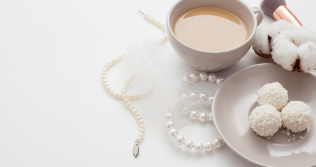 Wedding background, decorated with decorations for the bride's dress, white feather, cotton flower, pearl hairpins, around the text space, all in pastel colors. Concept preparation for the wedding